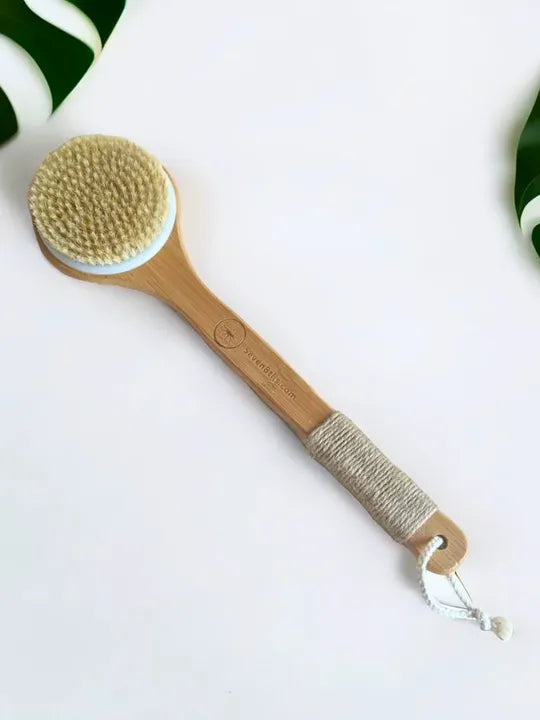 A long-handled bath brush
